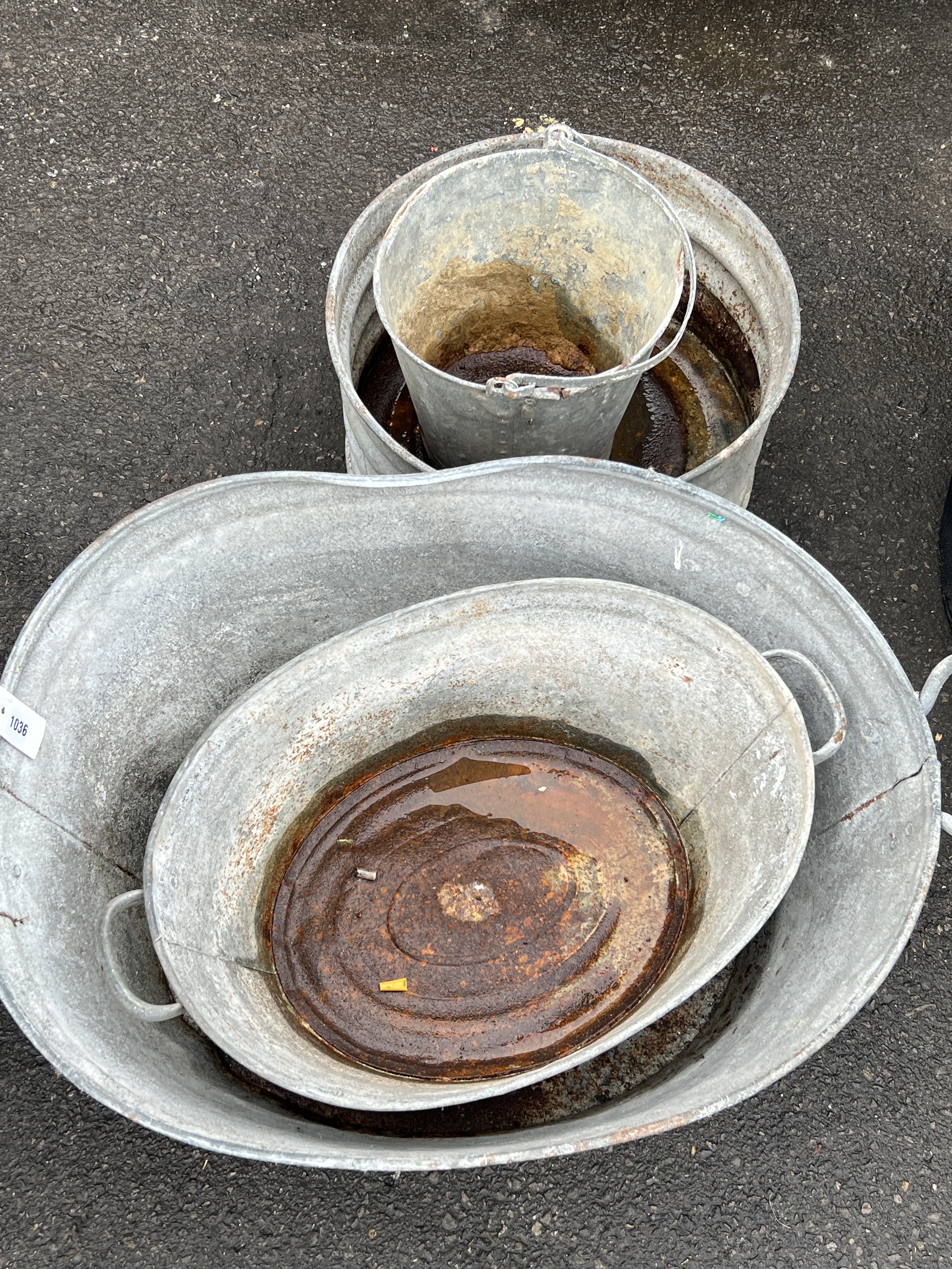 Four vintage galvanised buckets and containers, largest width 83cm, depth 60cm, height 37cm